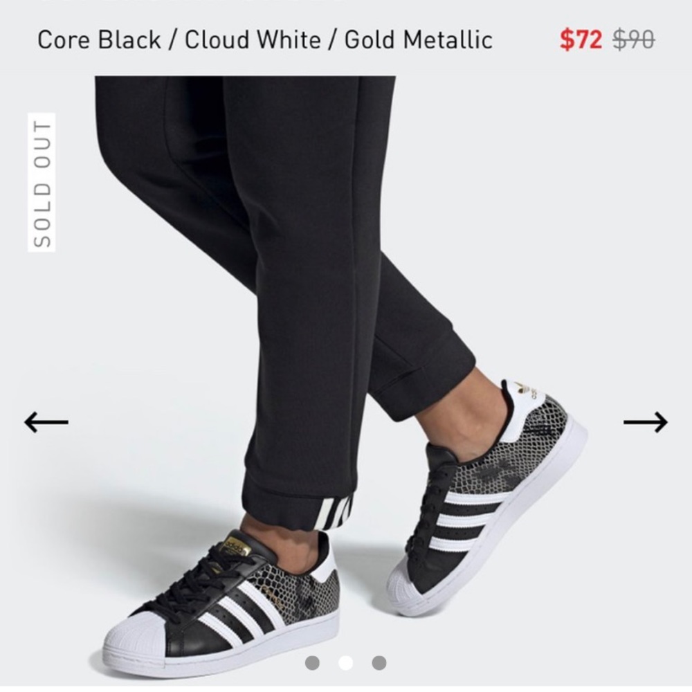 Black and white adidas with gold metal Superstars